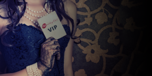 woman holding a VIP Club card
